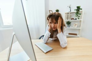 Shocked blonde businesswoman made big mistake in report look at screen